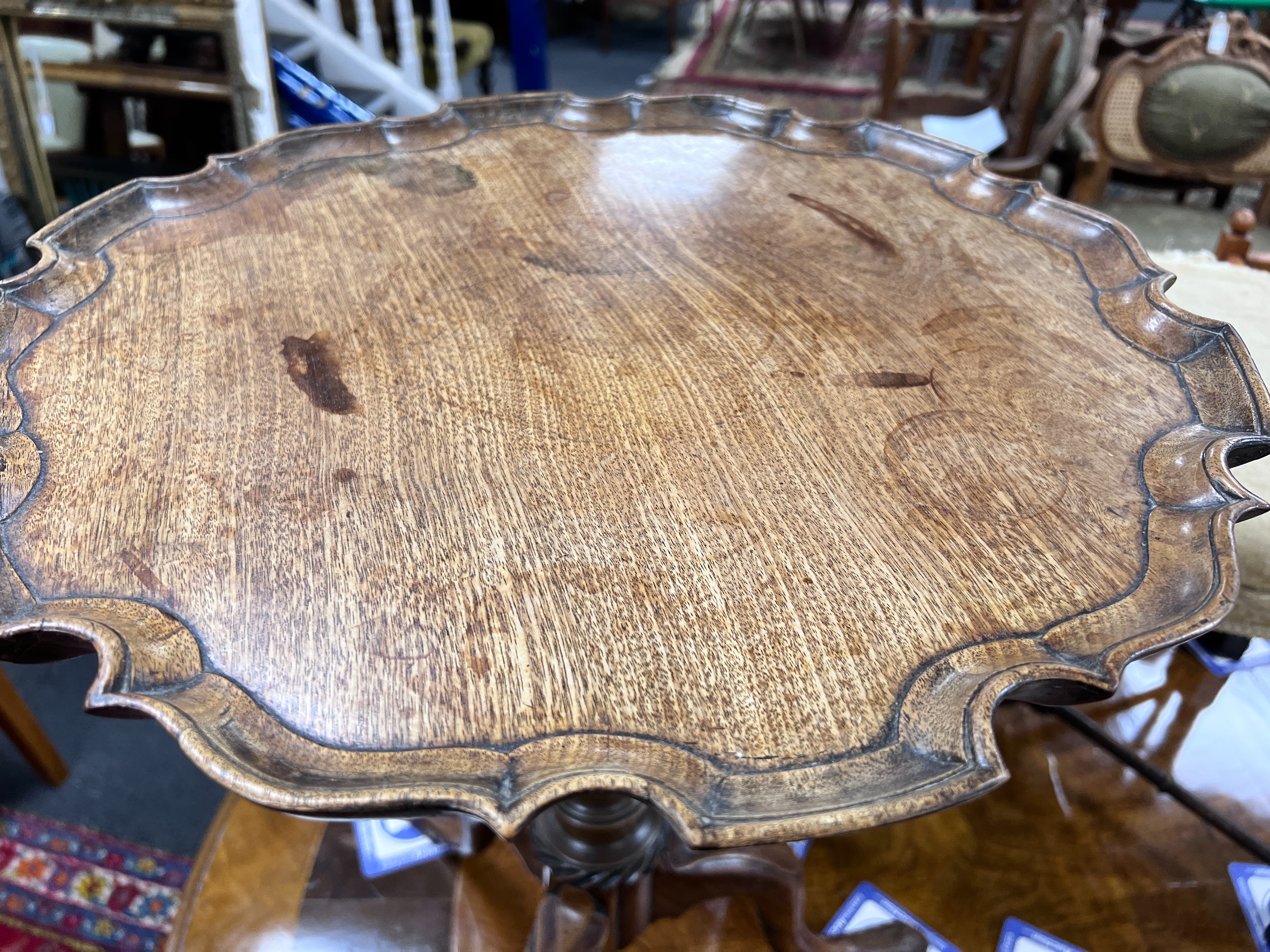 A George III circular mahogany piecrust tripod wine table, diameter 46cm, height 60cm